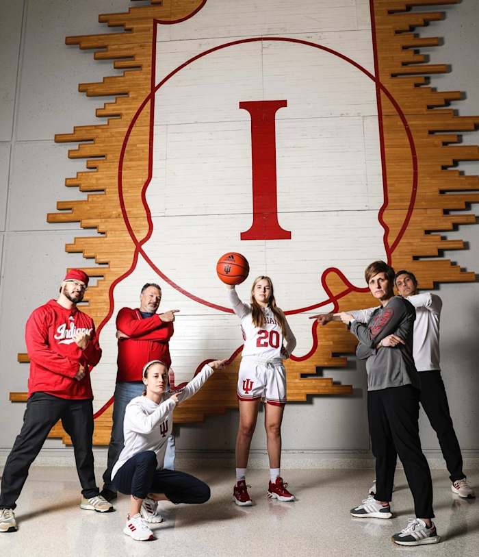 Julianna LaMendola poses with the Indiana women's basketball staff.